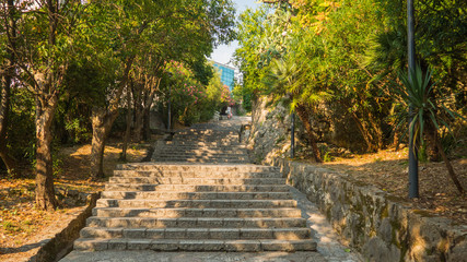 Wide brick stair going up with plants on the sides, Herceg Novi old town, Montenegro
