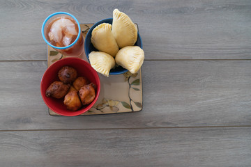 Nigerian Meat Pie Served With Iced Tea and Puff Puff