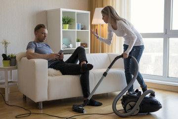 Young couple arguing about housekeeping issues