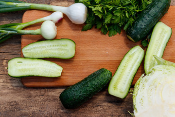 Ingredients for spring vegetable salad on rustic wooden table