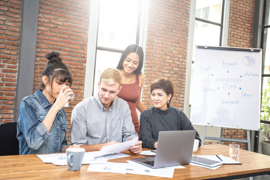 Group of diverse business people working together at modern office. Coworking concept.
