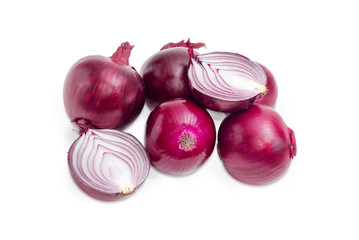Several whole red onions and one bulb cut in half