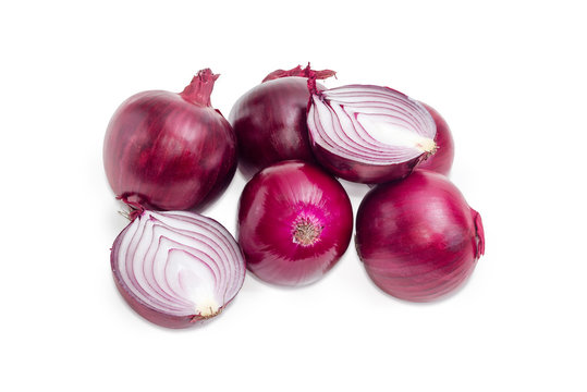 Several whole red onions and one bulb cut in half