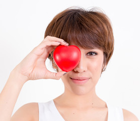 Beautiful young asia woman with red heart. Isolated on white background. Studio lighting. Concept for healthy.
