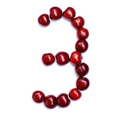 Number three. A figure composed of cherries isolated on a white background.