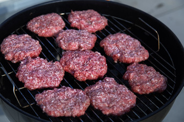 Homemade Hamburgers.Grill Meatballs. Raw Beef Meatballs. Outdoor Picnic.

