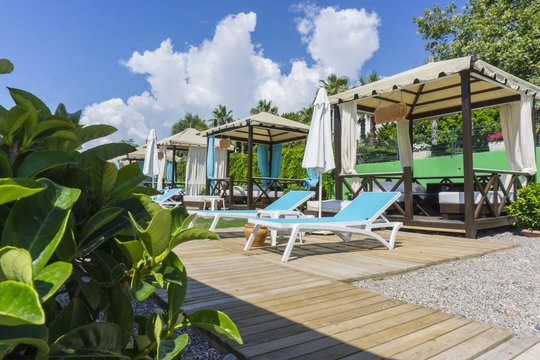 Luxury beach tents canopies on morning paradise white sandy beach