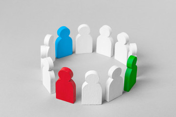 Concept leader of a business team. Crowd of white men stands in  circle and listens to the leader of blue and red and green