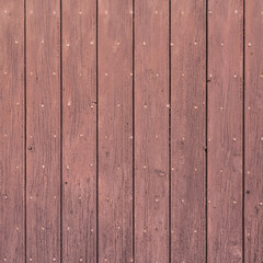 background consisting of reddish brown peeling paint on wooden shutters