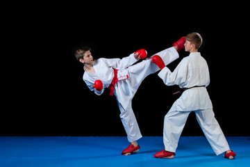 The studio shot of group of kids training karate martial arts © FS-Stock