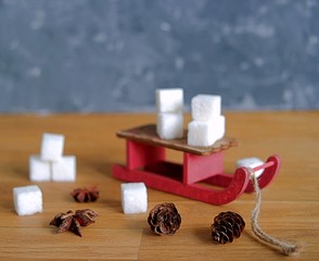 A composition of Christmas toys for Christmas and New Year holidays on a wooden background. Concept of Christmas and New Year holidays