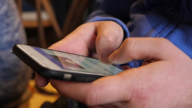 Man hands fingers typing smart phone chatting in messenger social media