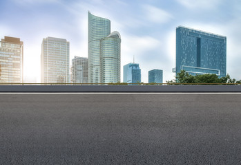 Fototapeta na wymiar Prospects for expressway, asphalt pavement, city building commercial building, office building