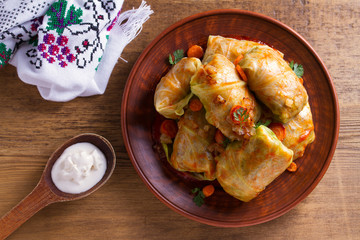 Cabbage rolls with meat, rice and vegetables. Stuffed cabbage leaves with meat. Chou farci, dolma, sarma, golubtsy or golabki. View from above, top studio shot