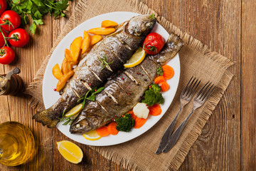 Grilled whole trout. Served with baked potatoes.