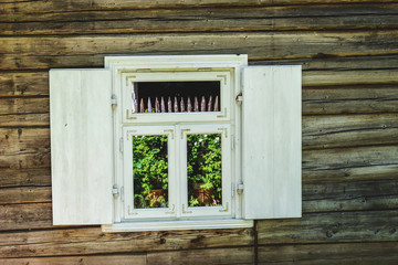 Fototapeta na wymiar old wooden houses with light windows