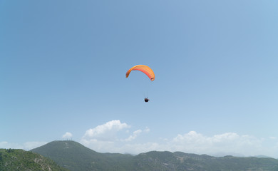 Tourists are engaged in paragliding
