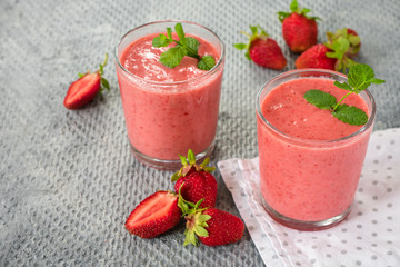 Two glasses of Strawberry smoothies.