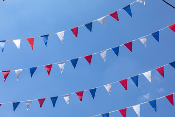 flag of France it is a tricolor flag colored blue white and red on blue sky