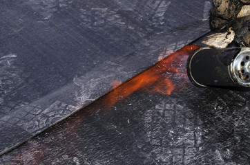 laying of waterproofing sheathing  and insulation during the renovation of a roof in Italy