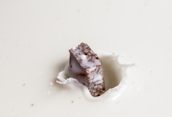 Chocolate falls in milk