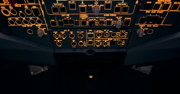 Modern Aircraft Cockpit Overhead Panel Panning Shot