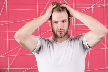 Man with bristle strict face enjoy freshness of hair, pink background. Haircare concept. Man with...