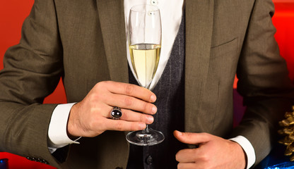 Christmas gift concept. Businessman holding glass of drink