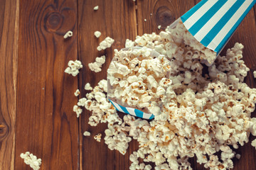 Salt popcorn on the wooden table