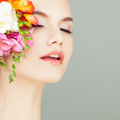 Fototapeta premium Closeup Portrait of Spa Woman. Healthy Skin and Flowers