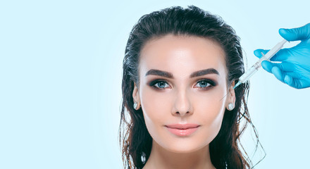 Fototapeta premium injections, cosmetology, beautiful female face with perfect skin