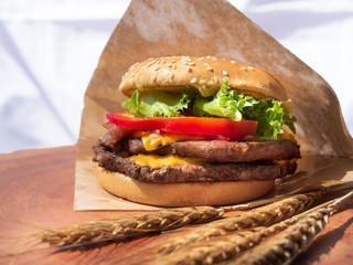 Double Hamburger on woodden board