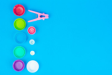 Plastic cap and clothespin concept.