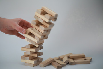 Board game jenga tower of wood sticks