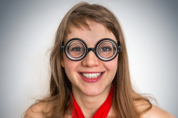 Obraz premium Funny geek or nerd woman isolated on gray background
