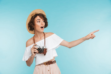 Portrait of an excited young woman in summer hat
