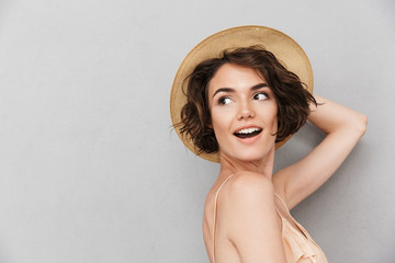 Close up portrait of a smiling young woman in hat