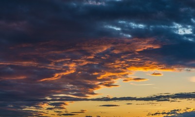 Dramatic sky at sunset with clouds