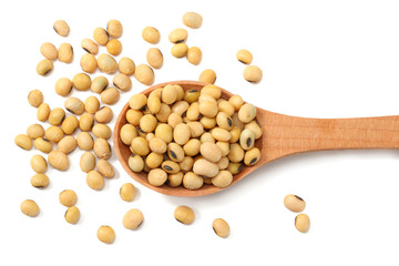 Soybeans in wooden spoon isolated on white background. top view