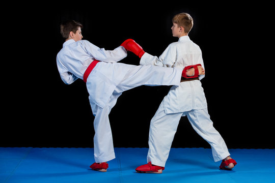 The studio shot of group of kids training karate martial arts
