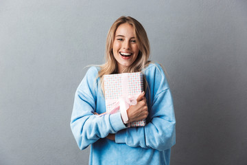 Portrait of a laughing young blonde girl