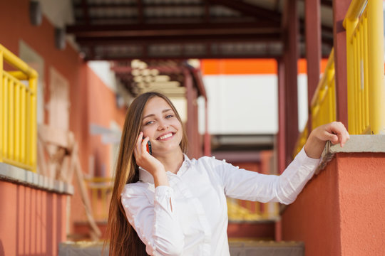 beautiful girl with phone in city