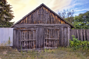 old wooden granary facade of a beautiful dilapidated barn