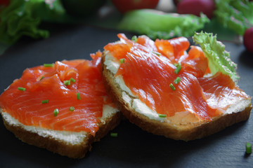 Sandwiches with red fish and curd cheese on toast