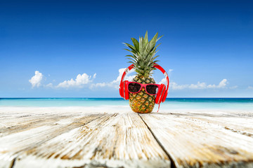 Pineapple on beach and summer time 
