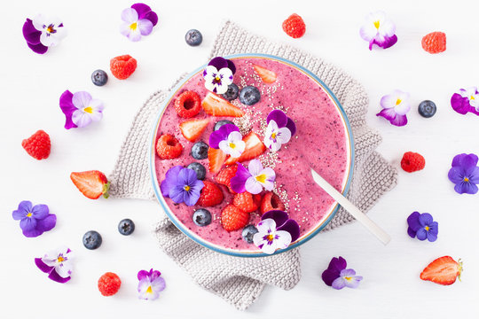 Healthy Summer Berry Smoothie Bowl With Flowers And Chia Seed