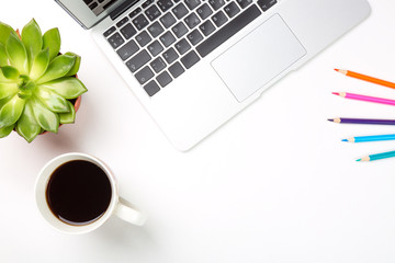 Conceptual workspace or business concept. Laptop computer with plant in a pot, cup of coffee and...