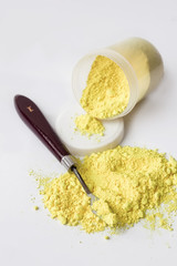 Neapolitan yellow pigment on a white background