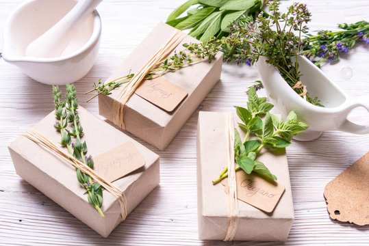 Carton boxes decorated with spices branches on wood table