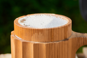 beer in a wooden mug